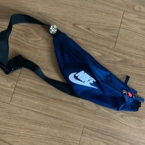 Navy blue/red and white Nike Fanny pack. Used maybe at least 3times